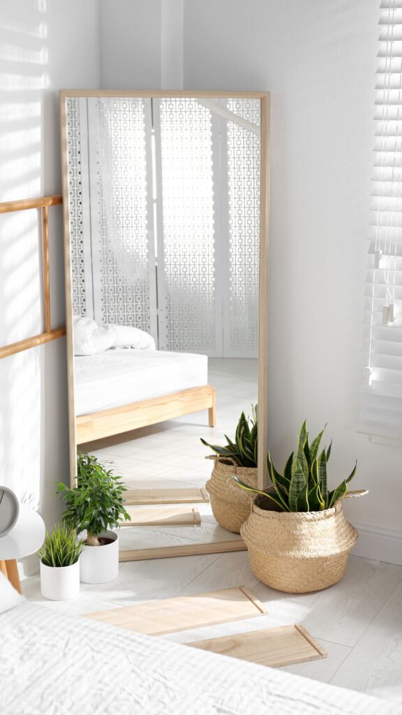 rectangular-standing-mirror-reflecting-sunlight-to-show-how-mirrors-expand-small-spaces.