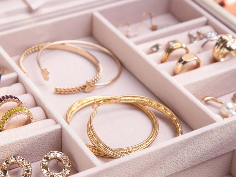 Jewelry-drawer-featuring-elegant-accessories-including-statement-necklace-gold-jewelry-bangles-bracelets-wristwatch-earrings-and-rings-perfect-inspiration-for-women's-fashion-and-jewerly-organization.