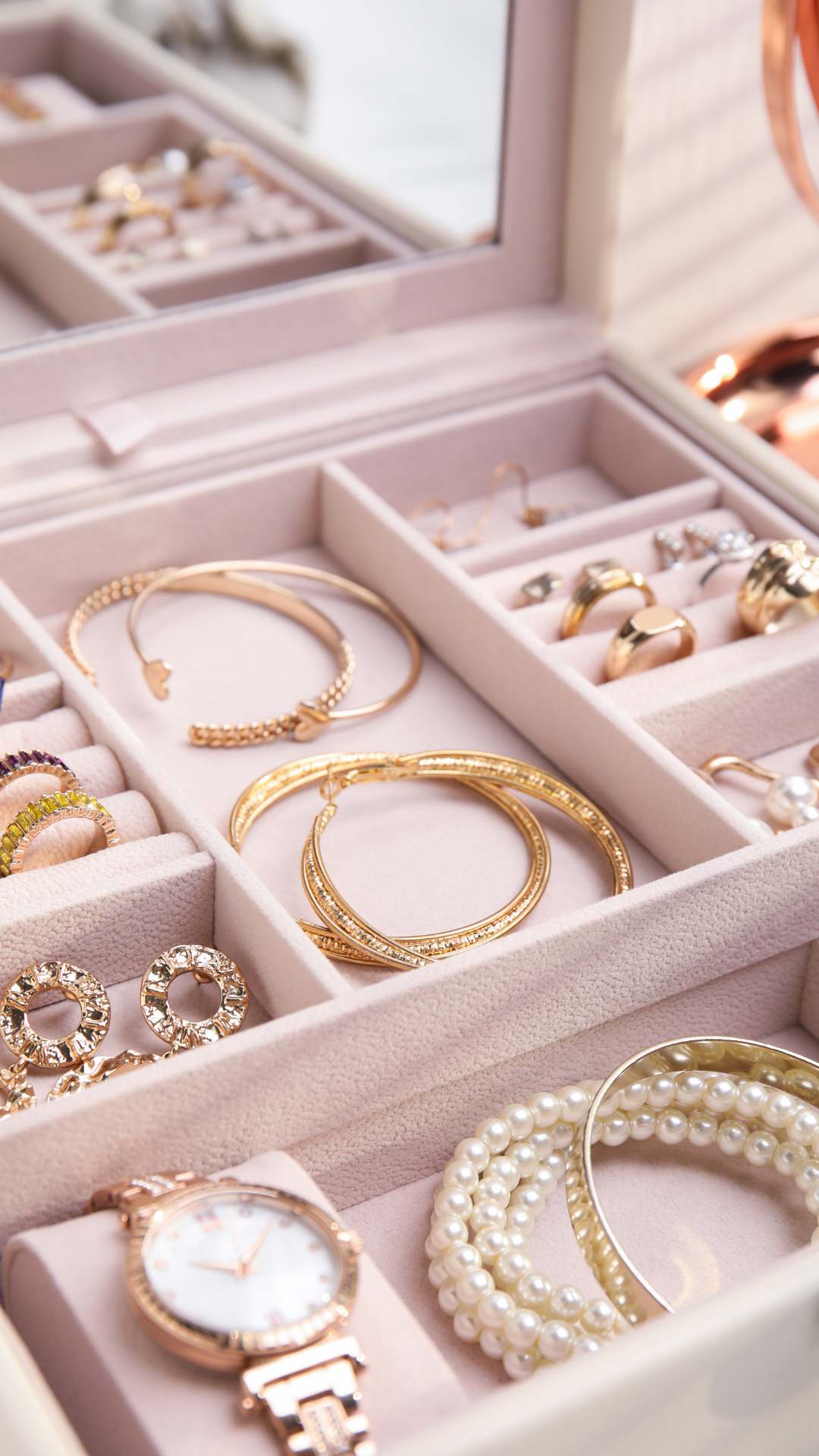 Jewelry-drawer-featuring-elegant-accessories-including-statement-necklace-gold-jewelry-bangles-bracelets-wristwatch-earrings-and-rings-perfect-inspiration-for-women's-fashion-and-jewerly-organization.