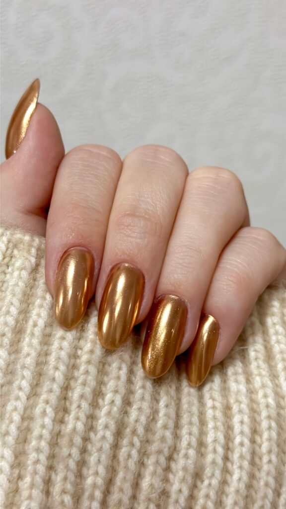 A-woman-with-gold-painted-nails