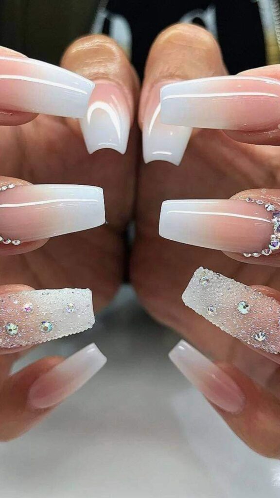 A-woman-with-painted-light-brown-nails-and-silver-foil-as-her-30-new-year-nail-designs