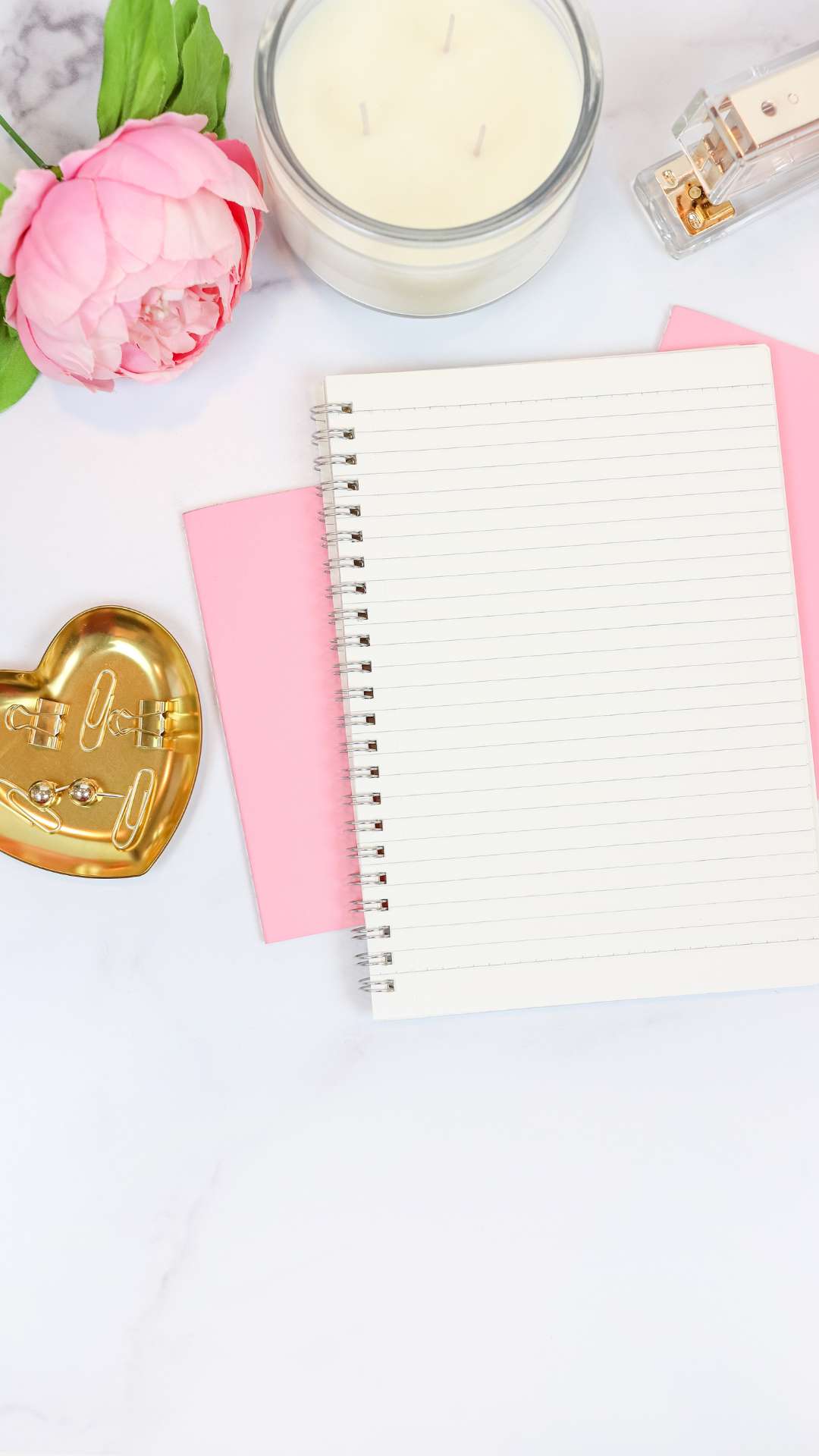 Personal-touches-for-girly-bedroom-decor-like-journals-flower-and-candleon-the-table