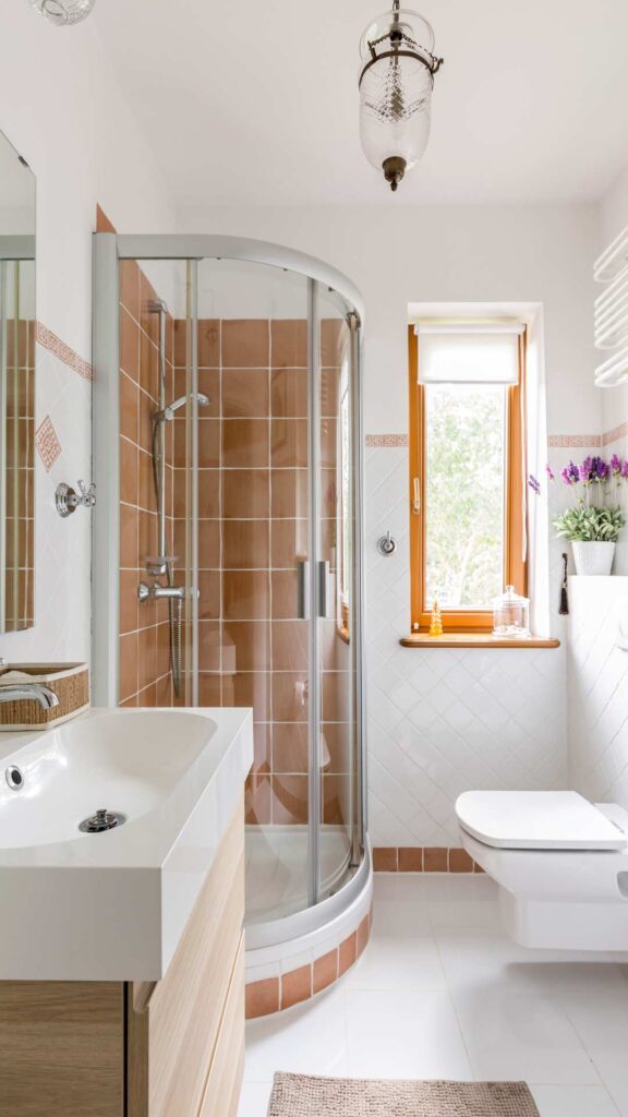 A-bright-modern-bathroom-with-soft-neutral-wall-colors-wooden-accents-and-plants-perfect-inspiration-for-bathroom-makeover-ideas