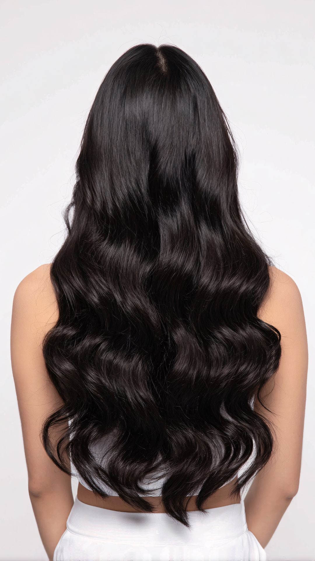 A-woman-that-turned her-back-showing-the-length-of-her-healthy-hair