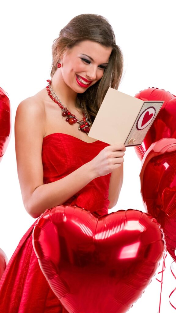 An-image-of-a-woman-reading-a-valentine-note-wearing-a-red-dress-as-valentine's-day-outfit