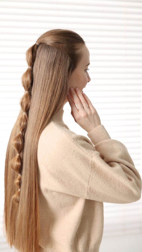 A-woman-with-styled-long-golden-hair