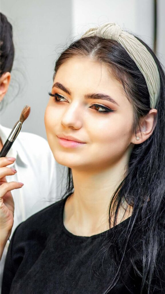 Office-appropriate-hair-and-makeup-for-women-with-soft-waves-natural-tones-and-a-romantic-professional-appearance.