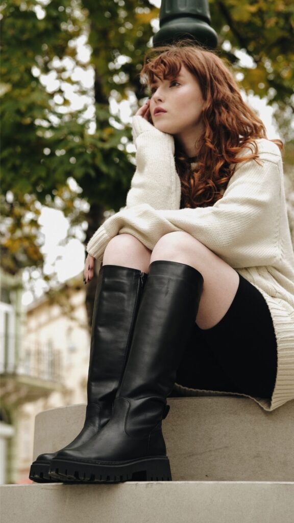 A-woman-wearing-black-Knee-High-Boots-as-15-winter-fashion-inspo