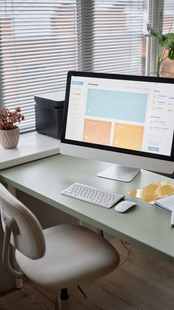Feminine-office-ideas-showing-green-office-desk-and-desktop-and-a-keyboard-on-top-of-the-table