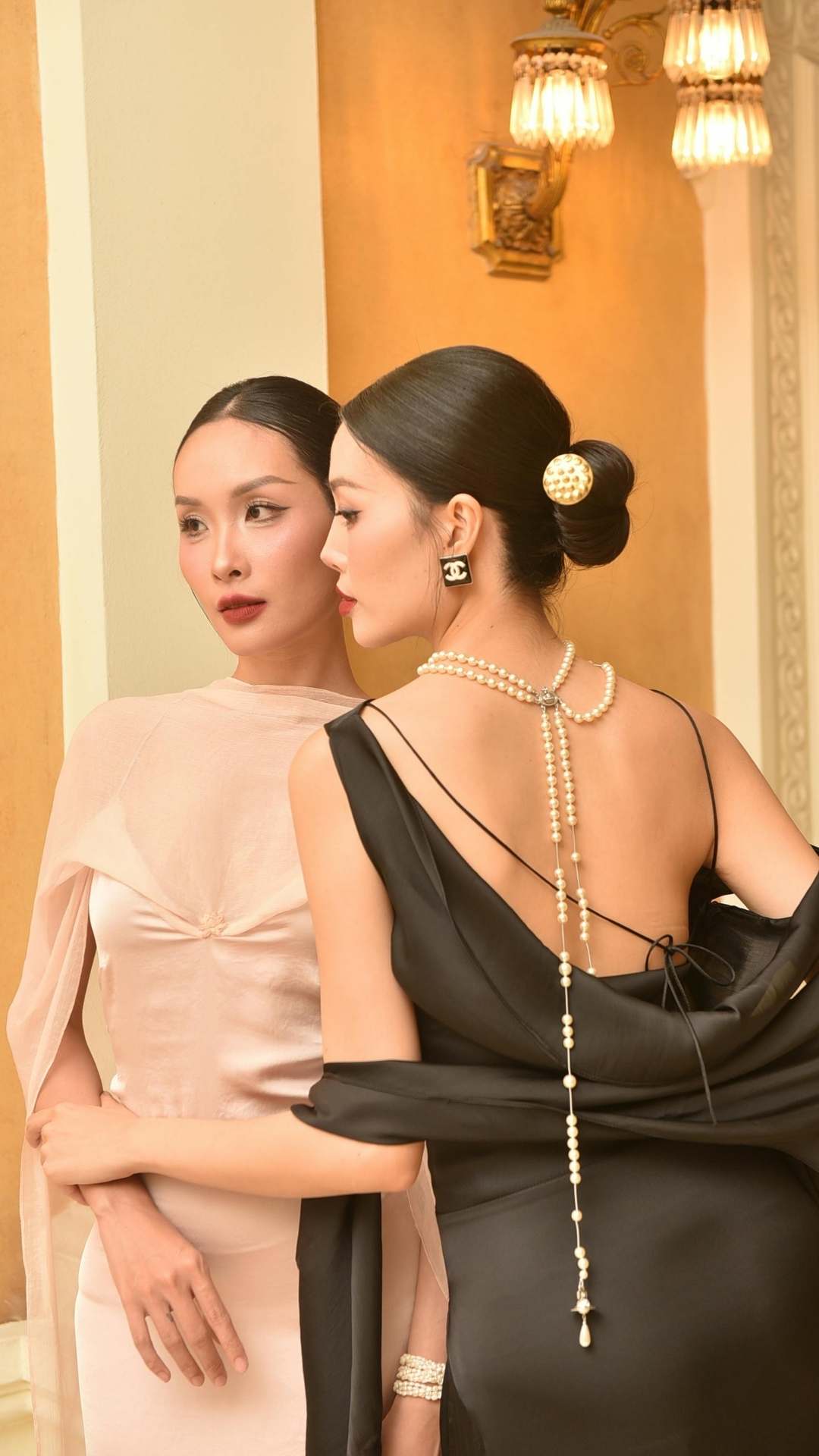 Stylish-and-timeless-accessories-including-neck-ear-and-wrist-jewelry-on-a- lady-wearing-a-simple-elegant-dress