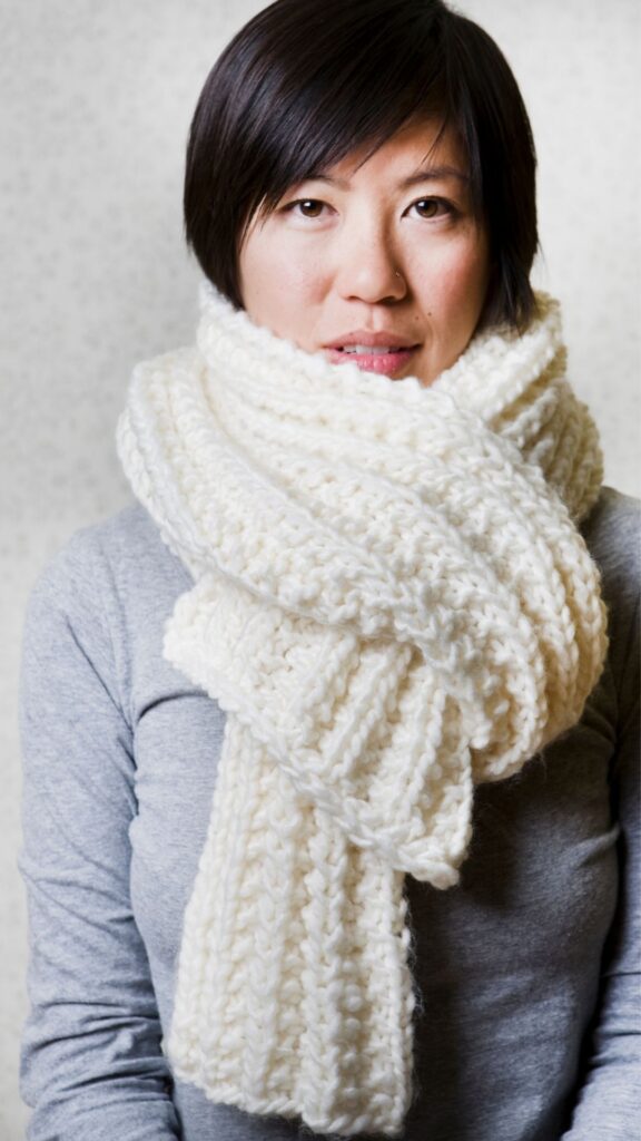 A-woman-wearing-ash-top-and-light-weight-scarves-as-one-of-her-layered-fall-outfits