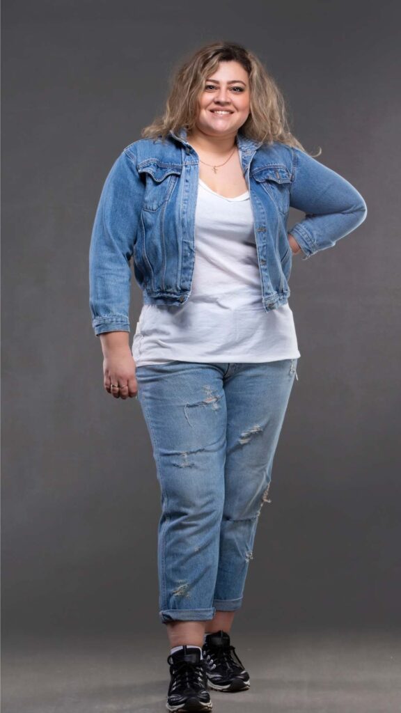 Chic-plus-size-casual-outfit-styled-with-jeans trousers-white-polo-top-and-denim-jacket-for-a-modern-Valentine’s-Day-look.