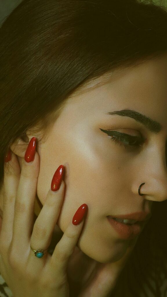 A-woman-showing-off-her-classy-glossy-red-nails-as-valentines-day-nails-ideas