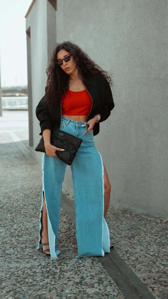 Stylish-spring-outfit-featuring-layered-denim-jeans-with-a-light-jacket-and- breathable-top.