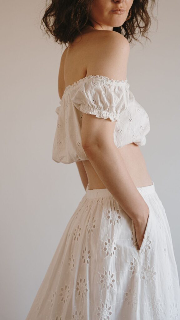 Matching-2-piece-showing-a-woman-wearing-biege-colored-crop-top-and-long-biege-skirt-as-her-summer-outfit-ideas-for-women