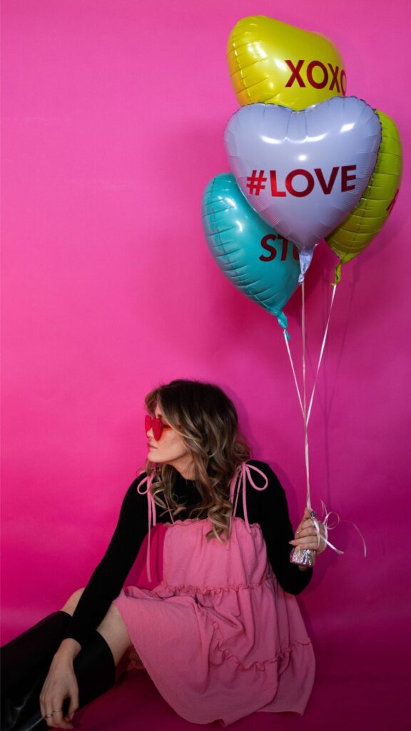 A-woman-that-is-wearing-pink-and-black-for-sol-valentines-day-photoshoot