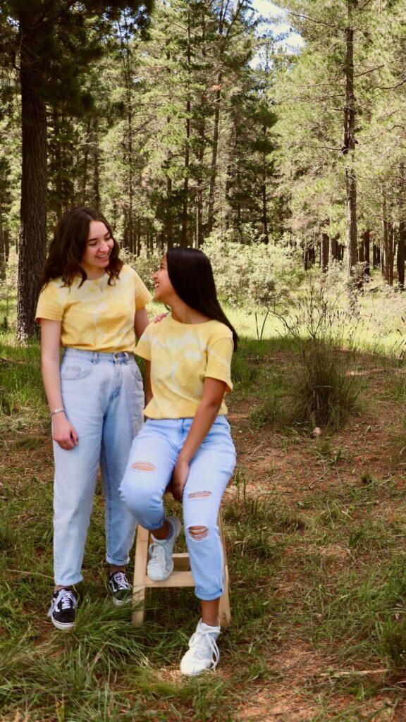 A-woman-wearing-Elevated-denim-jeans-and-yellow-top