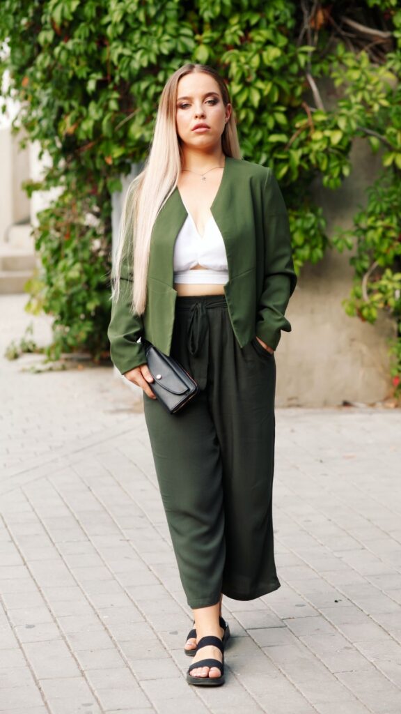 A-woman-green-blazer-with-inner-top-and-green-pant-as-her-st.-patricks-day-outfit-ideas