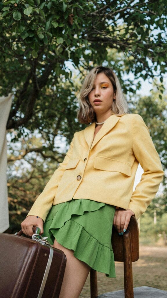 A-woman-wearing-green-skirt-and-yellow-blazer