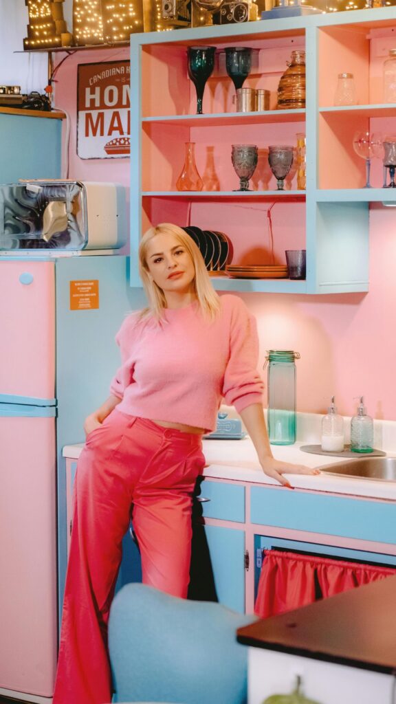 A-woman-wearing-pink-top-and-pink-pants-as-her-coachella-outfit-ideas-for-women