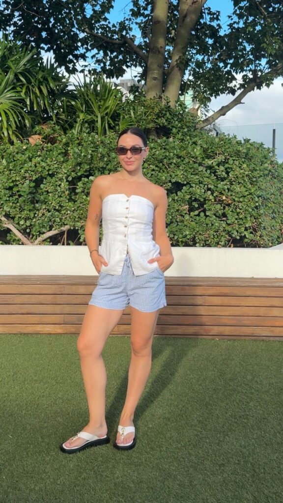 A-woman-wearing-Denim-short-white-for-her-4th-of-july-outfits-for-women