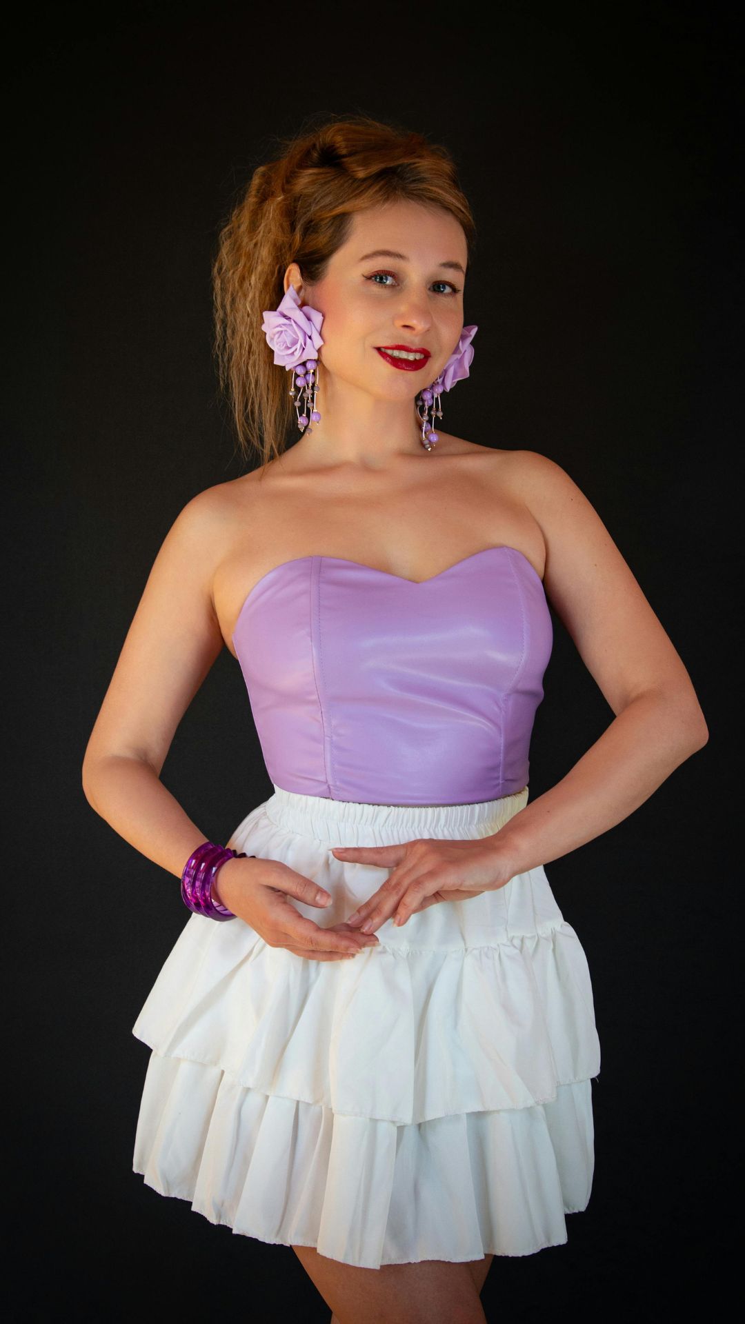 Featured-image-of-4th-of-july-outfits-for-women-showing-a-woman-wearing-light-purple-top-and-white-skirt