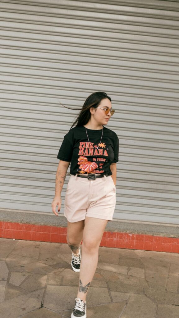 A-woman-wearing-brown-short-and-black-top-as-her-4th-of-july-outfits-for-women