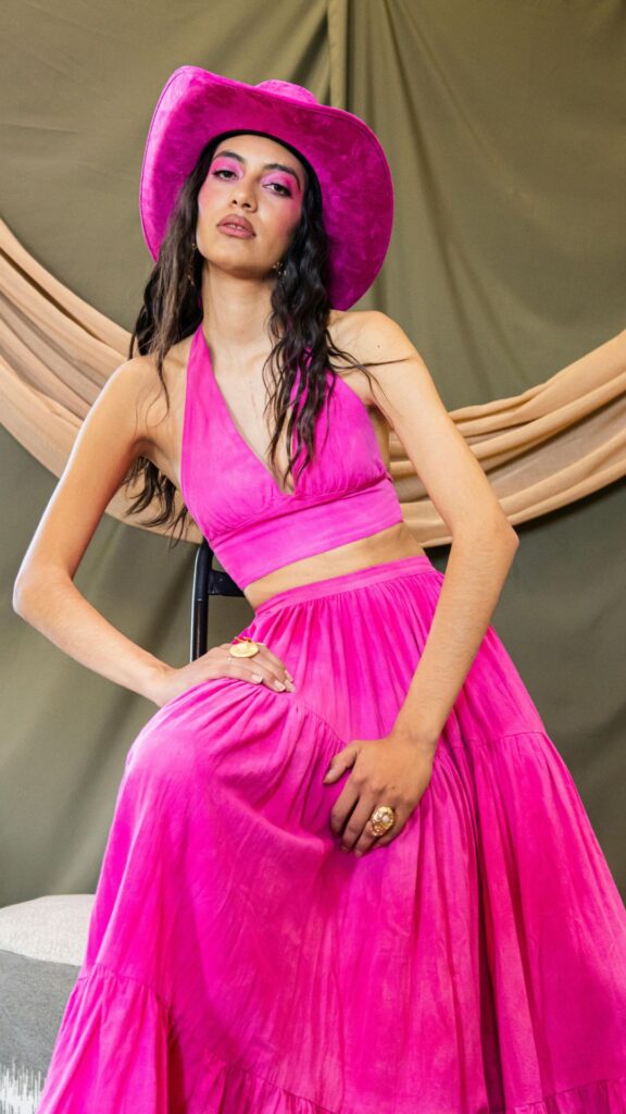 A-woman-wearing-pink-top-and-maxi-skirt