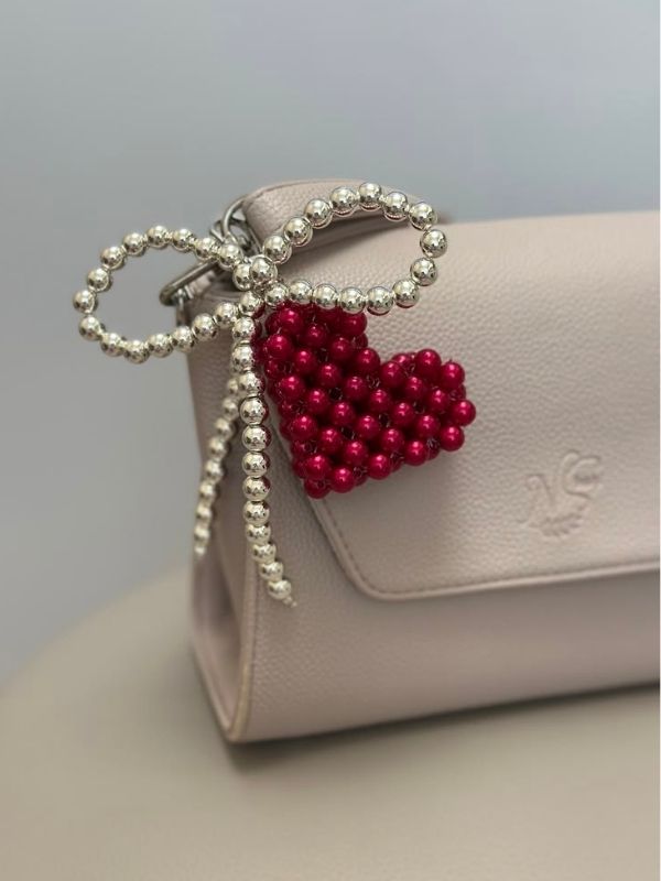 Image-of-a-bag-with-Beaded-Heart-Bag-Charm-as-how-to-make-diy-bag-charms-at-home