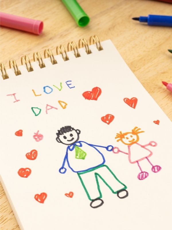 Handmade-fathers-day-card-showing-a-writing-I-love-you-from-a-child