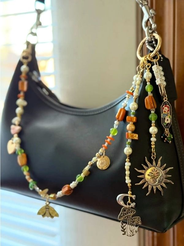 A-beautiful-black-bag-with-DIY-bag-charms-on-it