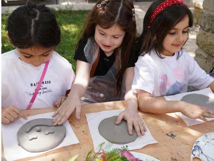 Simple-Memorial-Day- crafts-for-kids-showing-children-making-a-craft