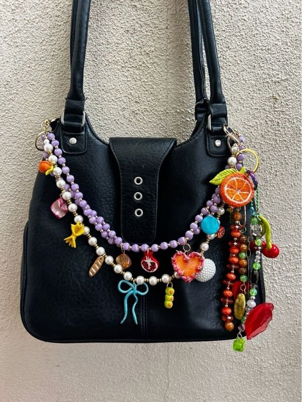 An-Image-of-black-handbag-showing-mixed-chains-and-charms-as-how-to-make-bag-charms-at-home