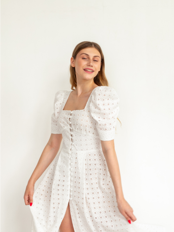 A-woman-wearing-white-flowy-dress-as-her-memorial-day-outfits