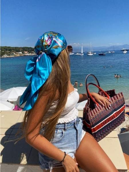 A-lady-on-Loose-Beach-Waves-with-Hair-Scarf-as-her-10-stunning-lake-day-hairstyles-that-stay-cute-all-day