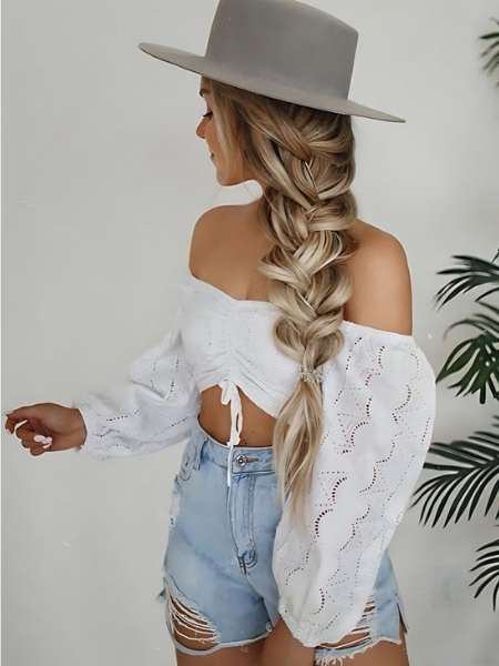 A-woman-on-one-Side-Swept-Hair-Under-a-Hat