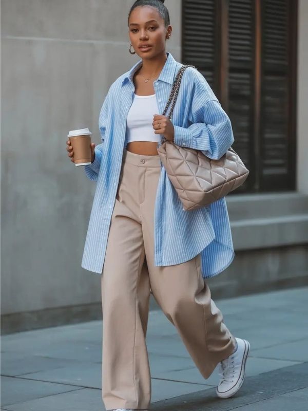 A-lady-wearing-blue-oversized-shirt-and-jeans-trousers