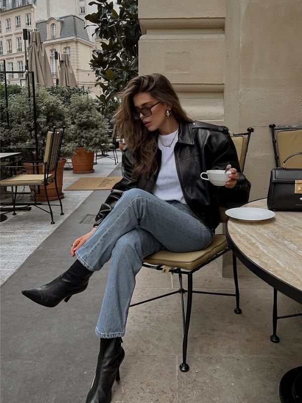 A-woman-wearing-a-classic-white-T-shirt-straight-leg jeans-and-clean-white-sneakers