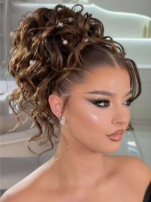 Textured-High-Bun-with-Soft-Side-Bangs.