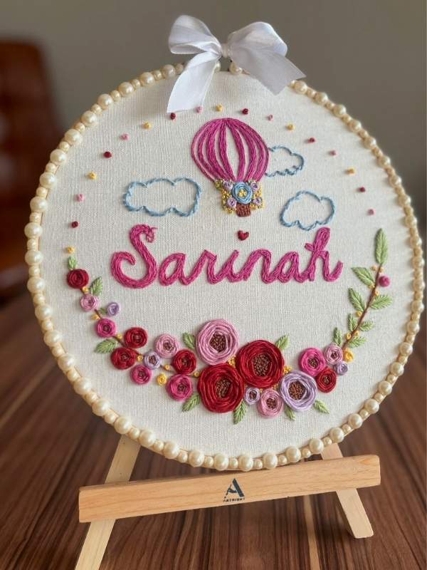 Personalized-Embroidery-Hoop-written-a-name-and-decorated-with-flowers