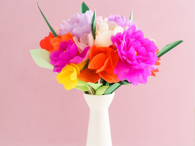 Featured-image-of-how-to-make-a-paper-flower-showing-a-hand-made-flower-in-a-vase