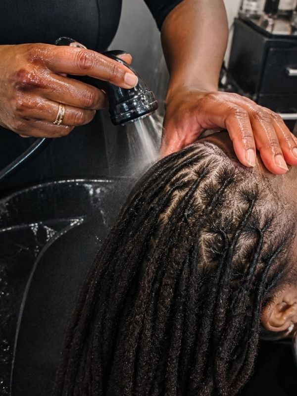 Image-of-a-woman-that-her-sisterlocs-is-being-washed