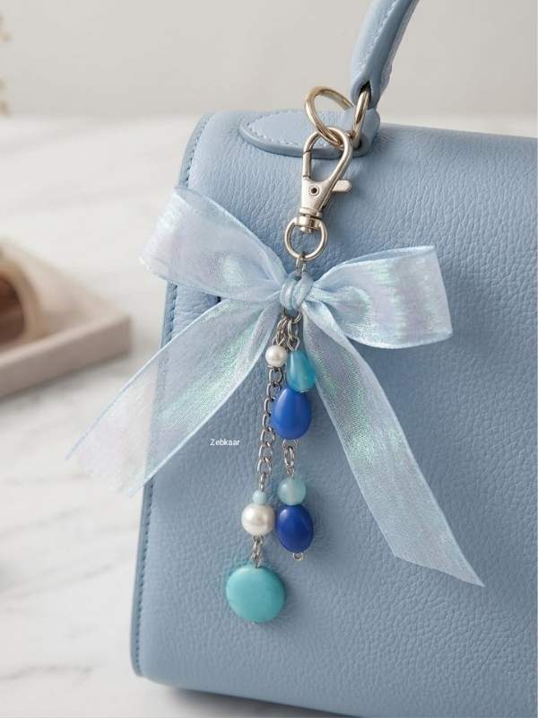 An-image-of-a-blue-bag-with-blue-ribbon-and-bead-accessories-