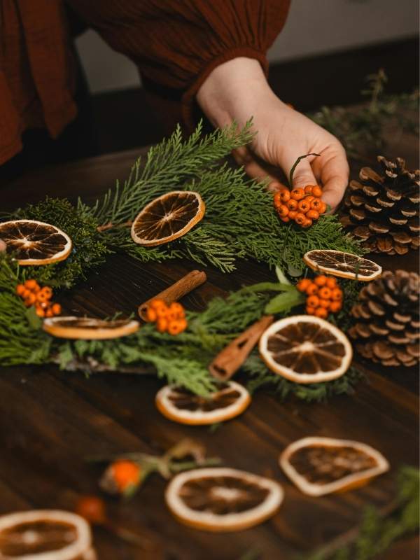 An-image-of-a-woman-making-a-Pinecone-wreath