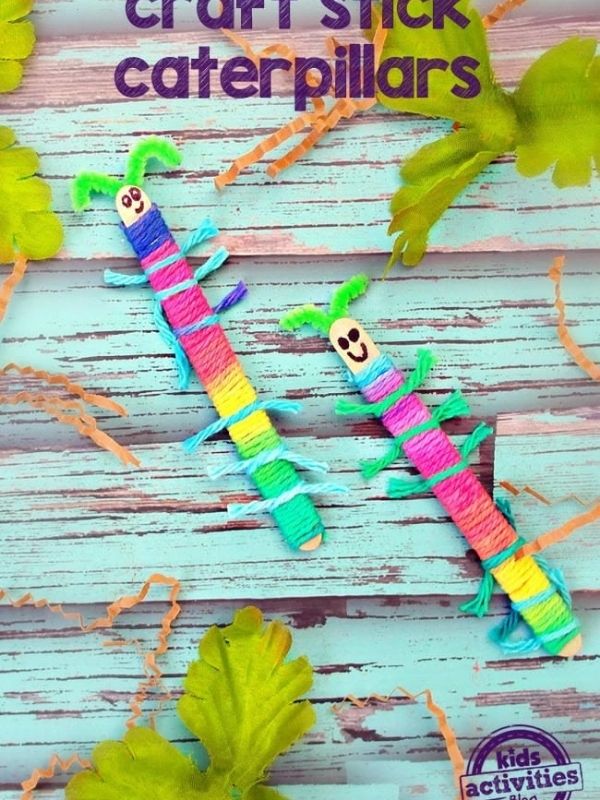 Popsicle-Stick-tied-with-a-pink-yellow-and-blue-yarn-and-designed-as-a-caterpillar