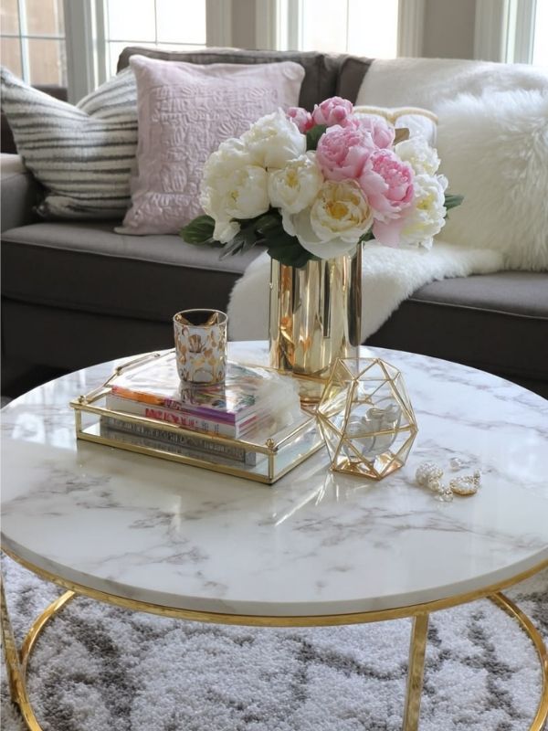 Image-of-a-table-with-a-small-vase-and-a-book-on-top-of-it