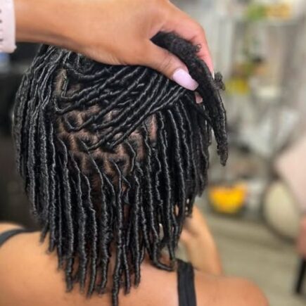 Featured-Image-of-Comb-Coils-for-Starter-Locs-showingg-image-of-a-woman-seated-down-while-another-person-is-making-her-locs