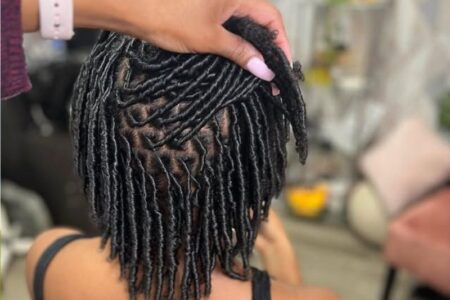Featured-Image-of-Comb-Coils-for-Starter-Locs-showingg-image-of-a-woman-seated-down-while-another-person-is-making-her-locs
