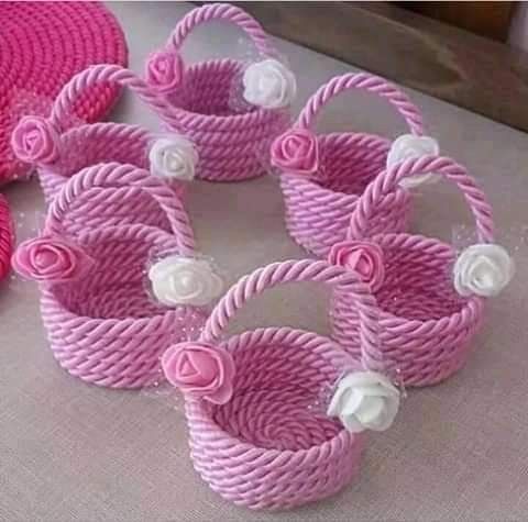 Handmade-miniature-pink-and-white-woven-baskets-with-beaded-handles